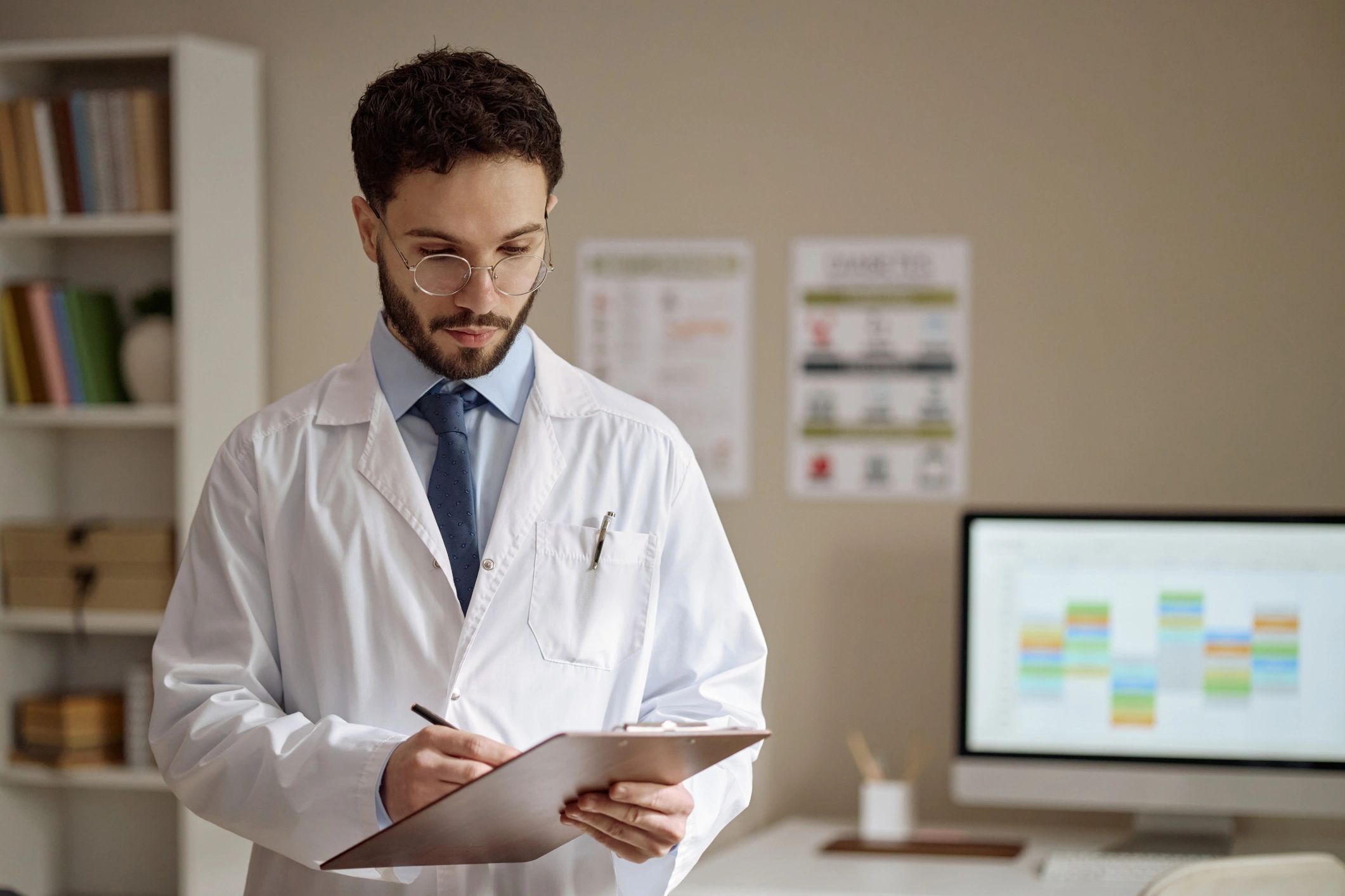 Doctor reviewing notes in a medical office