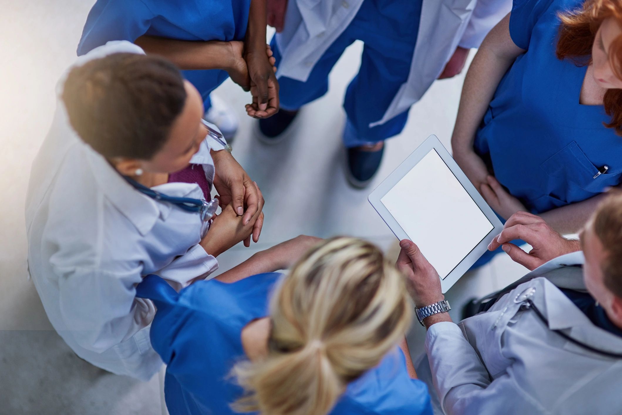 Research editor reviewing information with a medical team